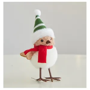 Detailed view of cute Christmas plush bird figurine with knit hat and red scarf