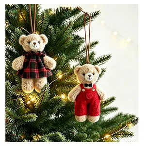 Detailed close-up of cute Christmas plush teddy bear ornaments hanging on a festive tree