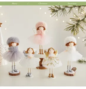 Collection of Christmas angel dolls with fluffy tutus and hats in a festive setting