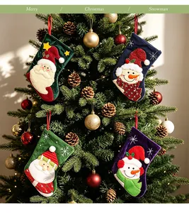 Set of small Christmas stockings hanging on a tree as festive ornaments