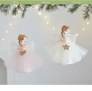 Detail view of cute angel girl ornaments with pink and white layered gauze skirts