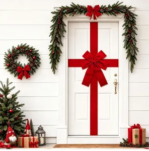 Stunning large red velvet Christmas bow decoration on a white door in a festive scene