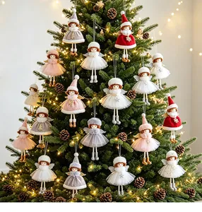 Adorable Christmas angel girl doll ornaments with tulle skirts hanging on a festive tree