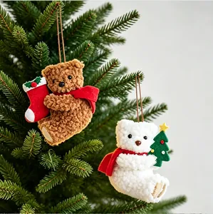 Close-up of adorable plush bear ornaments hanging on a Christmas tree branches