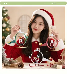 Detailed view of three metal Christmas helicopter ornaments with Santa and reindeer.