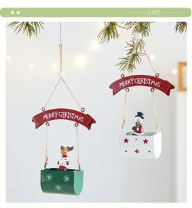 Detail of Christmas iron hanging baskets featuring cute snowman and reindeer figurines.