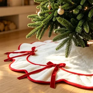 Elegant white plush Christmas tree skirt with red wavy trim and velvet bows