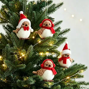 Set of four cute plush bird ornaments with Santa hats and scarves hanging on a Christmas tree.
