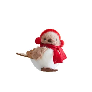 Cute Christmas bird ornament wearing red scarf and earmuffs for tree decoration