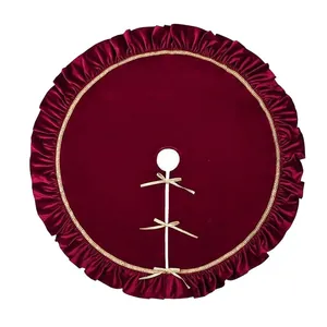 Elegant burgundy velvet Christmas tree skirt with ruffled edges and gold ribbon bows