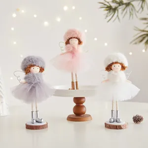 Handmade Christmas angel dolls with tulle skirts and fuzzy hats for festive home decor