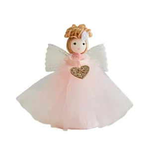 Handmade pink Christmas angel doll with yarn hair and golden heart for holiday decor