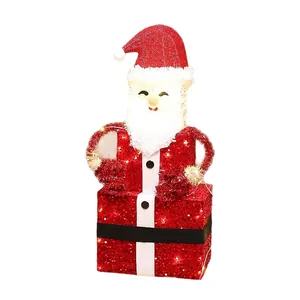 Festive glowing 3D Santa Claus gift box decoration with warm LED lights for Christmas