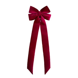 Grand nœud de Noël en velours rouge foncé avec de longs rubans pour décoration de fête