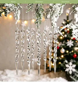 Detailed view of transparent twisted icicle ornaments hanging on snow-covered branches.
