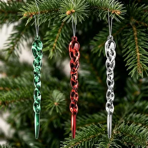 Colorful twisted icicle Christmas ornaments in green, red, and clear hanging on tree