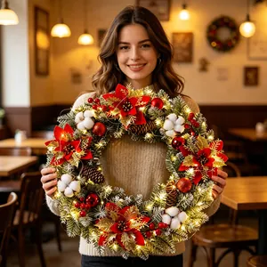 Pre-lit Christmas wreath with poinsettia flowers and cotton bolls for festive home decor