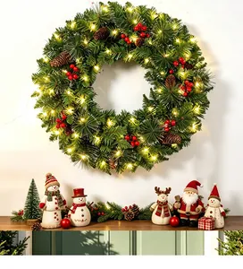 Detailed view of lighted Christmas wreath with pine cones and berries for festive decor