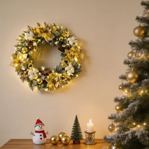Festive Christmas wreath with warm LED lights, golden poinsettias, and cotton decorations