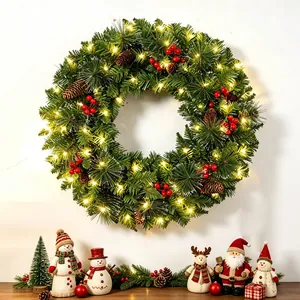 LED-lit Christmas wreath with red berries and pinecones for festive holiday door decor