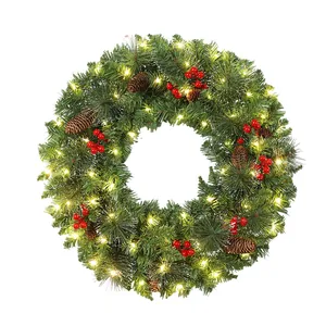 Pre-lit artificial Christmas wreath with pine cones and red berries for front door decor