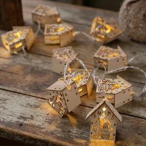 Wooden Christmas house string lights with warm LED glow for festive indoor decor