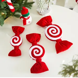Detailed view of red velvet candy Christmas ornaments featuring elegant white spiral designs
