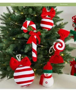 Detailed view of red and white velvet Christmas tree ornaments and snowman figurine