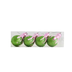 Set of four creative green glitter Christmas ball ornaments with pink octopus accents