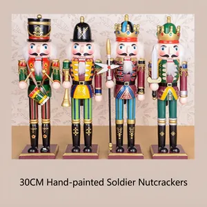 Lot de quatre figurines de casse-noisettes en bois peintes à la main de 30 cm de haut