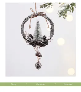 Detail of a rustic Christmas wreath ornament with pine cones and a mini tree
