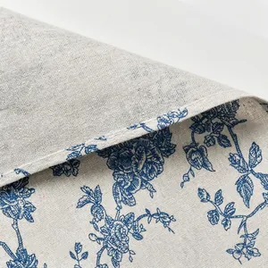 High-quality macro detail of cotton-linen fabric featuring a vintage blue floral pattern