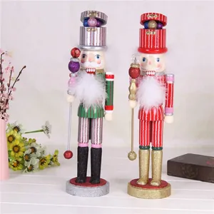 Pair of 38cm wooden nutcracker soldiers with glittery accents and fluffy beards