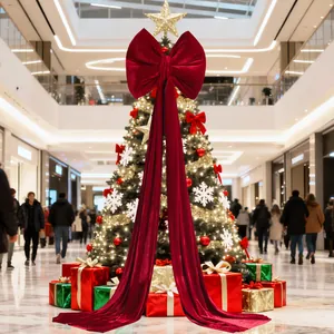 Grande fiocco natalizio decorativo in velluto rosso con lunghi nastri per l'albero.