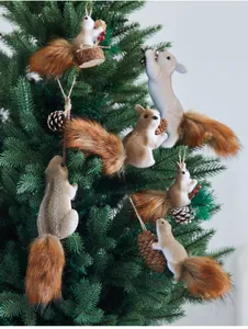 Detailed view of lifelike squirrel ornaments decorating a lush green Christmas tree