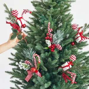 Decorative Christmas pick with red berries and candy canes for holiday tree decor