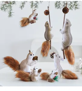 Detailed view of varied faux fur squirrel Christmas ornaments holding pinecones