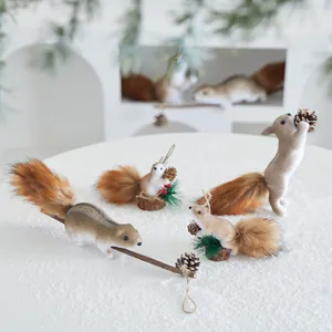 Set of realistic foam squirrel Christmas ornaments with fluffy tails and pinecones.