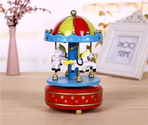Vintage style wind-up carousel music box with colorful horses and dome design