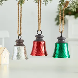 Set of three colorful Christmas iron bells with hammer texture and jute rope hangers