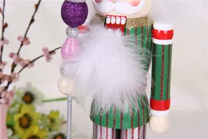 Detailed view of a colorful wooden nutcracker puppet with white feathers and glitter accents