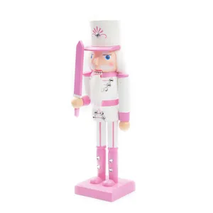 Pink and white wooden nutcracker soldier statue with sword decoration