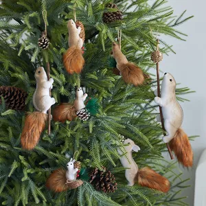 Lifelike foam squirrel ornaments climbing a Christmas tree branch with pine cone accents
