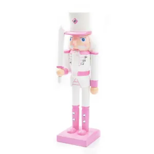 Detailed view of a 38cm pink and white wooden nutcracker soldier holding a sword