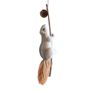 Realistic squirrel Christmas tree ornament with fluffy tail and pinecone decoration