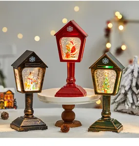 Set aus drei weihnachtlichen Schneekugellaternen im Vintage-Briefkasten-Stil mit Licht.