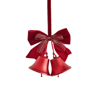 Elegant red metal Christmas bells with a plush velvet bow for festive home decor