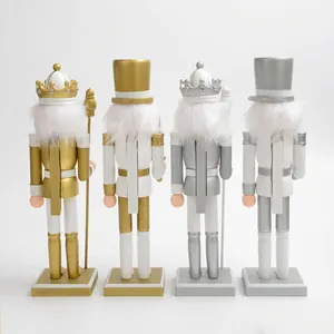 Back view of four 30cm gold and silver Christmas nutcracker soldier figurines