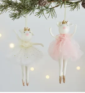 Whimsical mouse ballet dancer ornaments with tutus and crowns on a Christmas tree branch