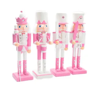 Detail showing set of four 38cm pink wooden Nutcracker soldiers for Christmas decor